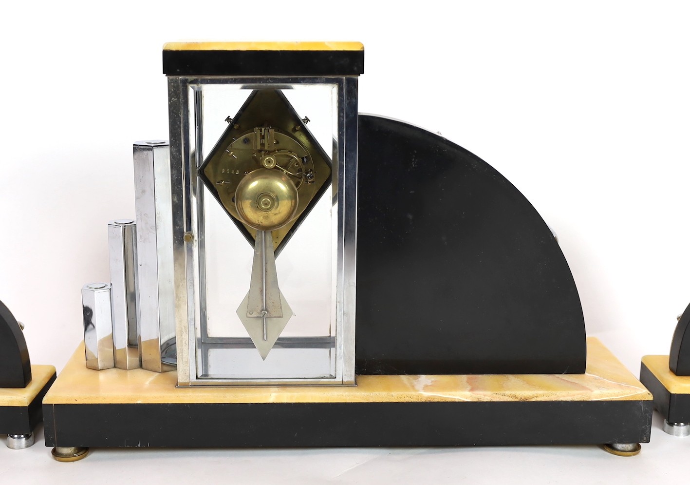 A French Art Deco chrome and marble clock garniture, by H. Loiseau of Chateauroux, clock 50cm wide, 35cm high, lamps 28cm high